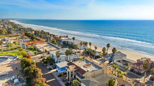 an aerial view of beach and ocean