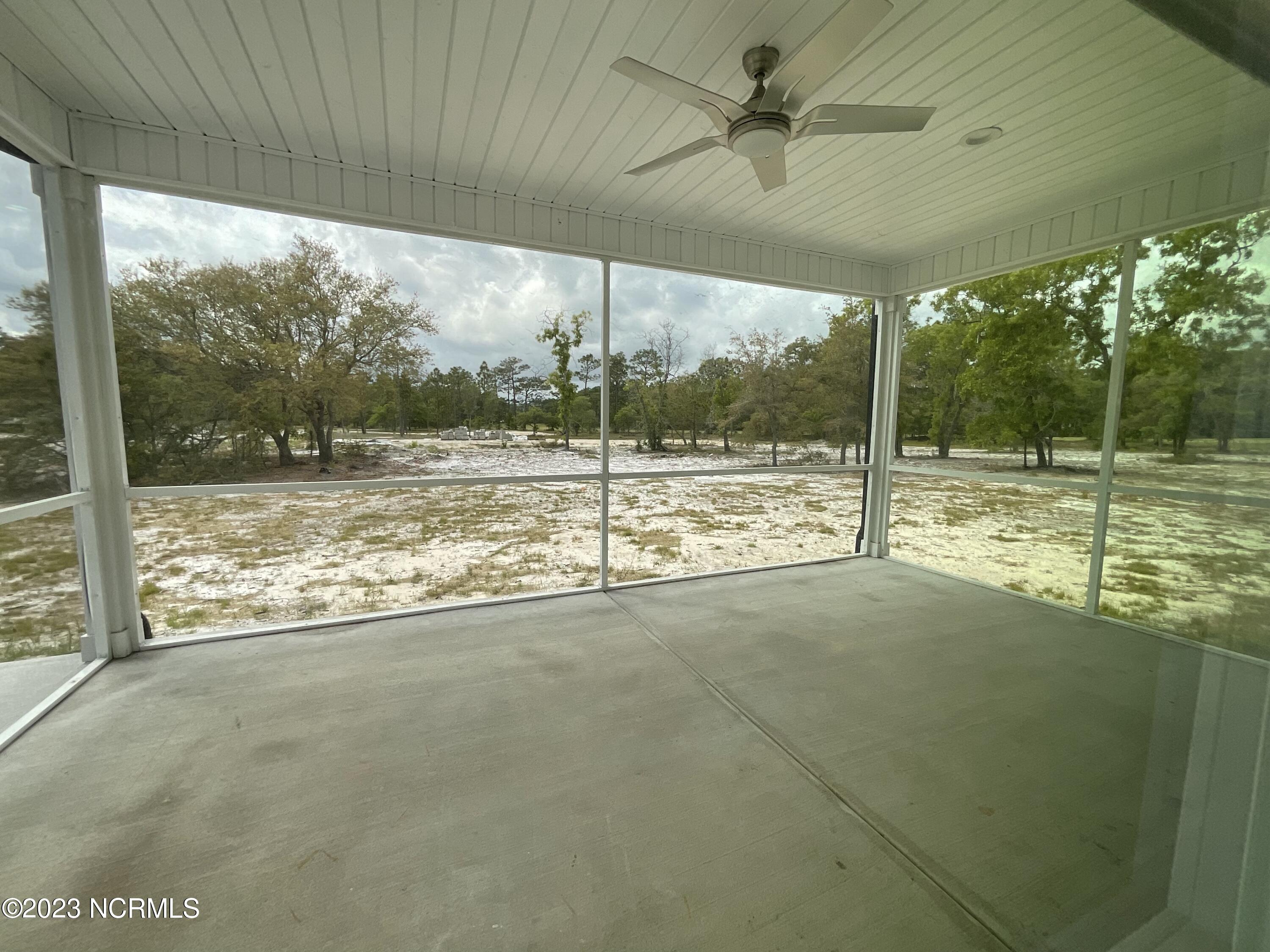 901 Nicklaus Road Boiling Spring Lakes, NC 28461 - Photo 21 of 33 SCREENED BACK PORCH WITH FAN LIGHT