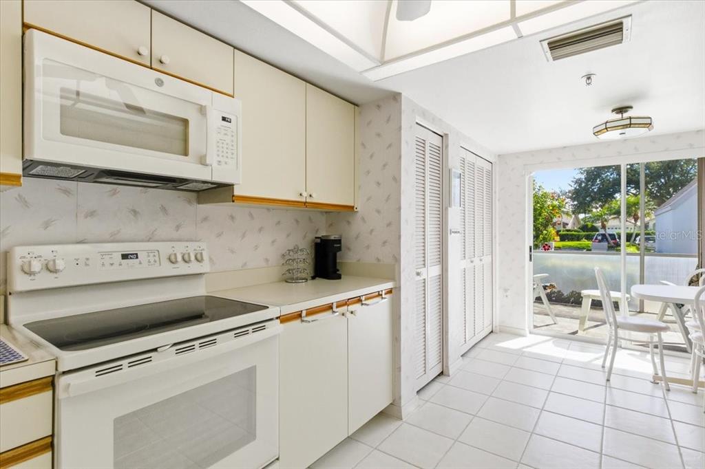 6713 Stone River Road, Unit 103 Bradenton, FL 34203 - Photo 23 of 86 a kitchen with a stove and a refrigerator