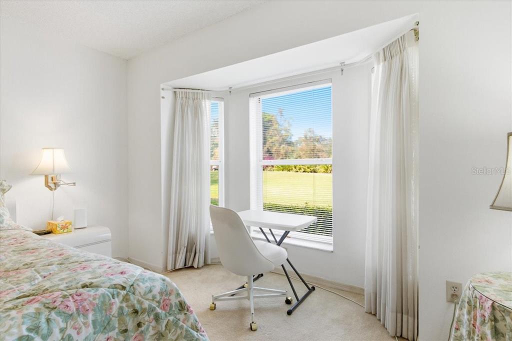 6713 Stone River Road, Unit 103 Bradenton, FL 34203 - Photo 32 of 86 a bedroom with a bed and a window