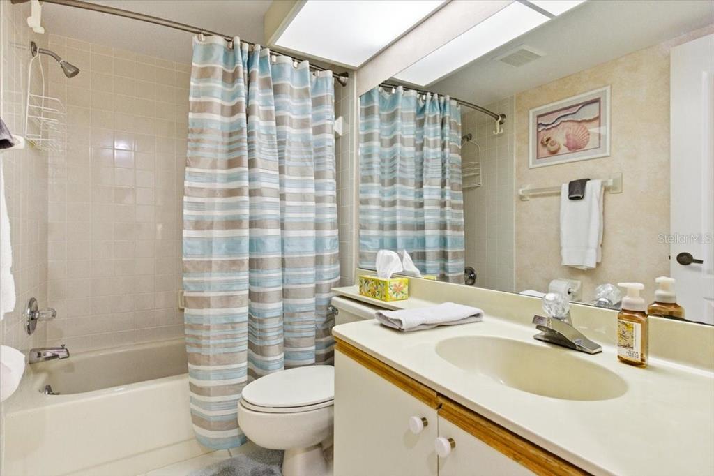6713 Stone River Road, Unit 103 Bradenton, FL 34203 - Photo 40 of 86 a bathroom with a granite countertop sink toilet and shower