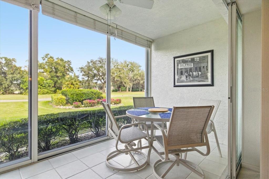 6713 Stone River Road, Unit 103 Bradenton, FL 34203 - Photo 42 of 86 a view of a dining room with furniture window and outside view