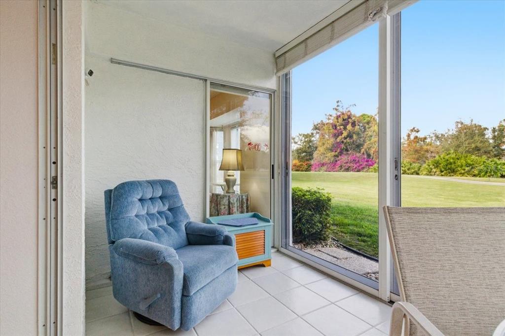 6713 Stone River Road, Unit 103 Bradenton, FL 34203 - Photo 43 of 86 a living room with furniture and a gate