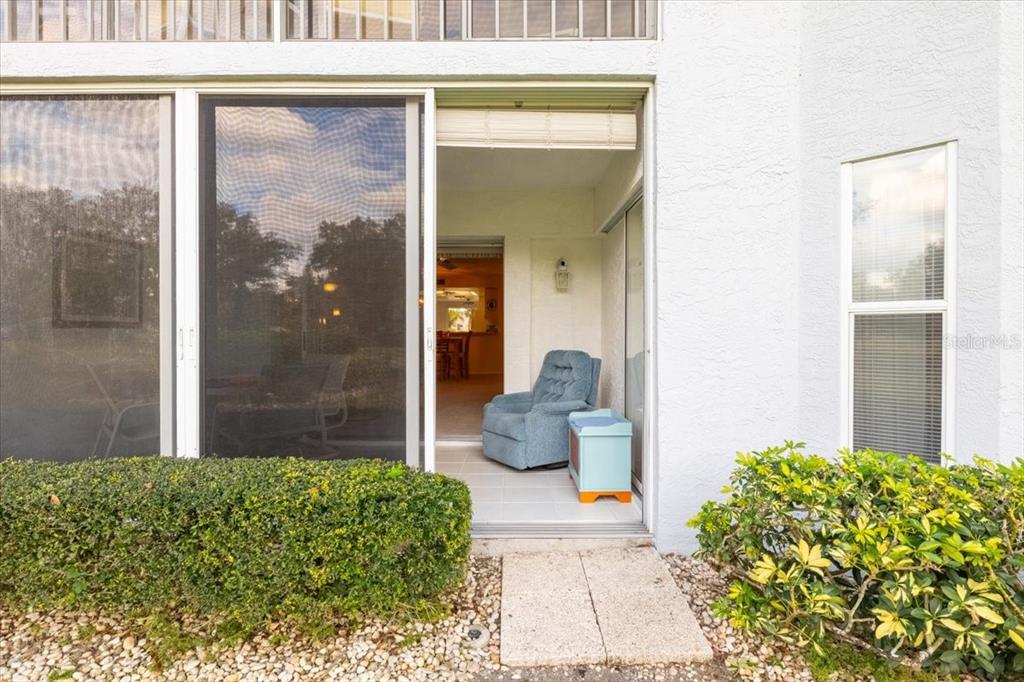 6713 Stone River Road, Unit 103 Bradenton, FL 34203 - Photo 45 of 86 a front view of a house with a garden