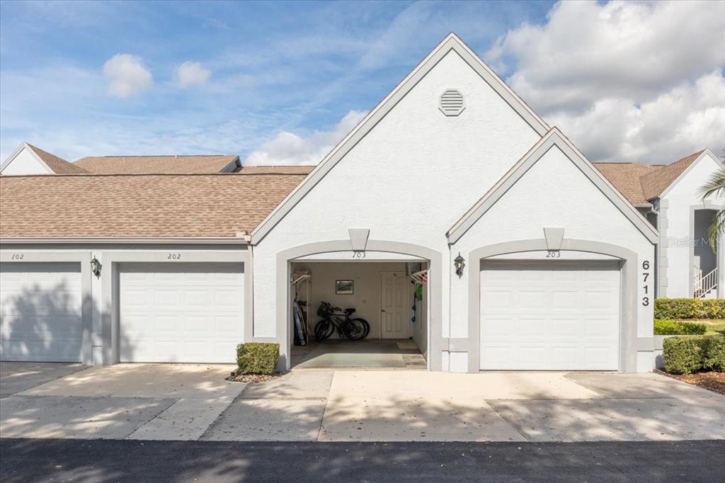 6713 Stone River Road, Unit 103 Bradenton, FL 34203 - Photo 48 of 86 a view of entrance gate of the house