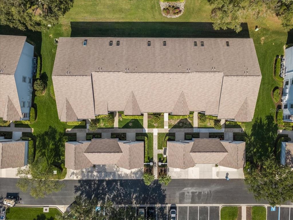 6713 Stone River Road, Unit 103 Bradenton, FL 34203 - Photo 62 of 86 an aerial view of a house with a yard