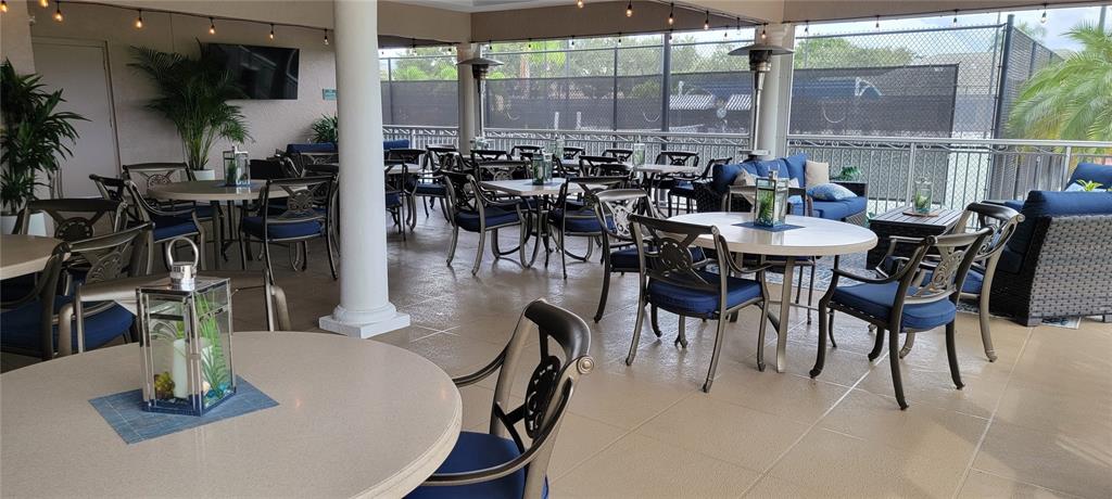 6713 Stone River Road, Unit 103 Bradenton, FL 34203 - Photo 82 of 86 an outdoor dining space with furniture and outdoor view