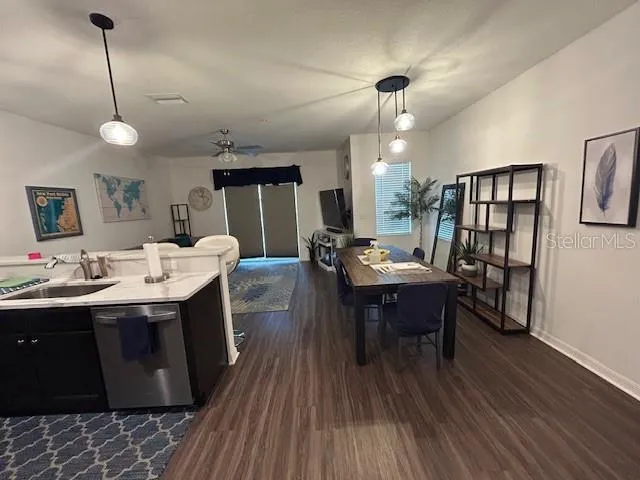 a view of kitchen island filled with furniture and wooden floor