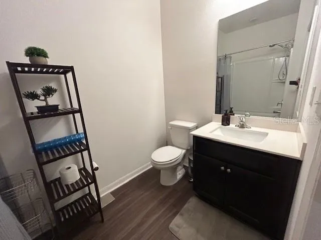 a bathroom with a toilet a sink and a bathtub