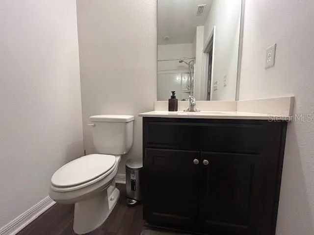 a bedroom with a bed and a mirror