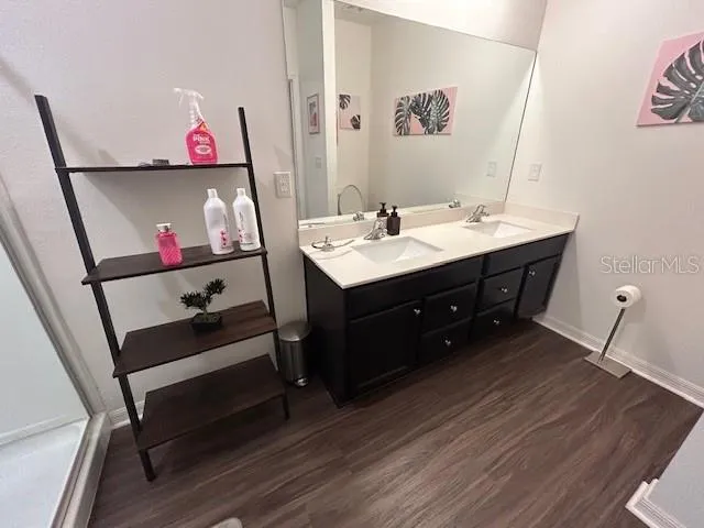 a bedroom with a bed and a mirror