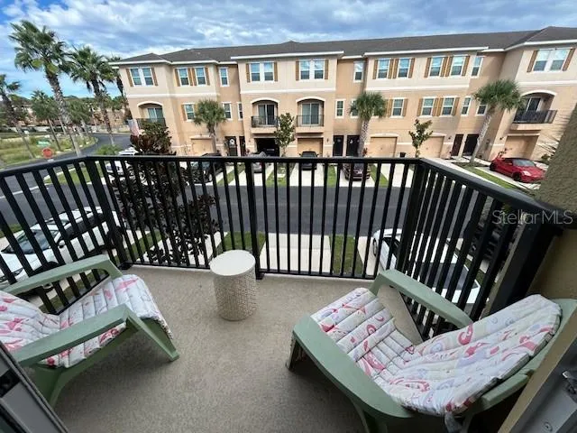 a view of a chairs and table in the patio