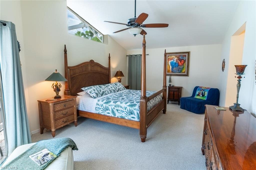 458 Countryside Drive Naples, FL 34104 - Photo 20 of 50 Carpeted bedroom with ceiling fan and high vaulted ceiling