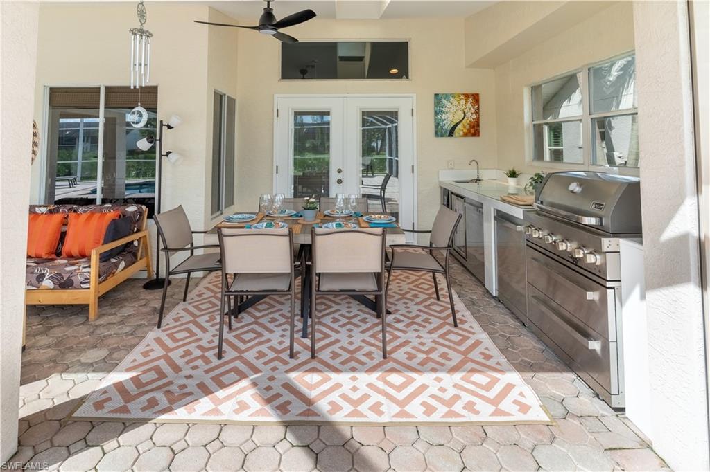 458 Countryside Drive Naples, FL 34104 - Photo 33 of 50 View of patio / terrace featuring outdoor dining area, ceiling fan, french doors, and area for grilling