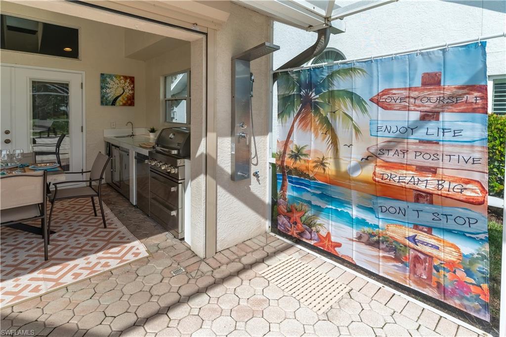 458 Countryside Drive Naples, FL 34104 - Photo 40 of 50 View of patio / terrace with an outdoor kitchen and a sink