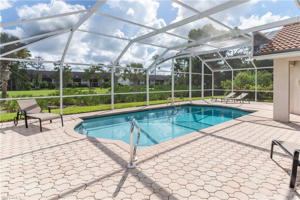 458 Countryside Drive Naples, FL 34104 - Photo 41 of 50 Outdoor pool featuring a patio, a lanai, and a sunroom