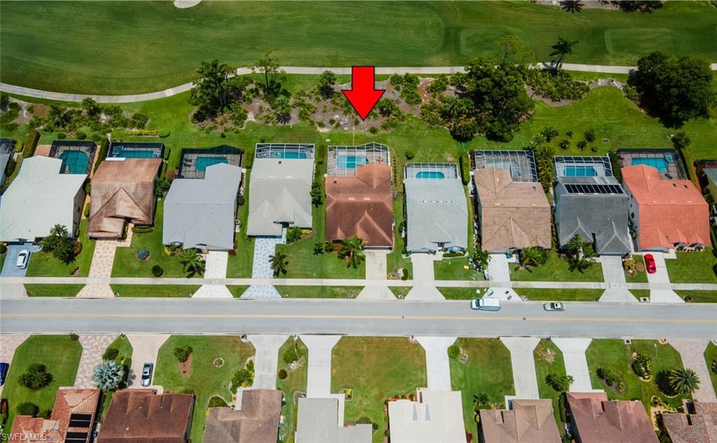 458 Countryside Drive Naples, FL 34104 - Photo 43 of 50 Aerial perspective of suburban area featuring a local golf course