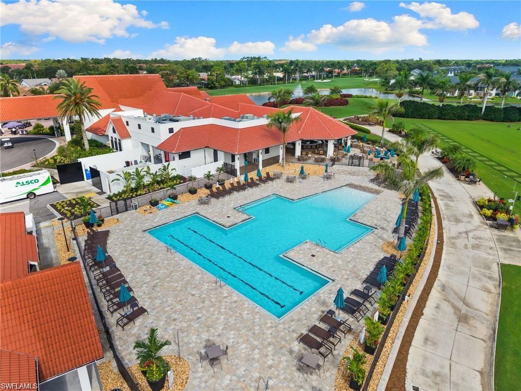 458 Countryside Drive Naples, FL 34104 - Photo 45 of 50 Community pool with a patio area and a water view