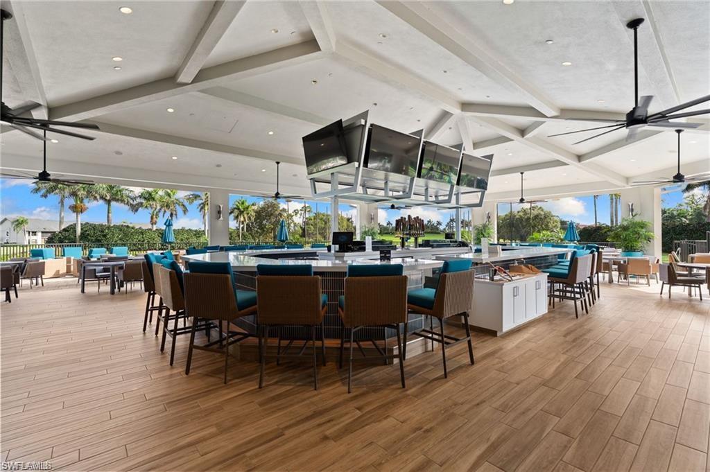 458 Countryside Drive Naples, FL 34104 - Photo 47 of 50 Dining area featuring a ceiling fan, beamed ceiling, light wood-style flooring, and recessed lighting