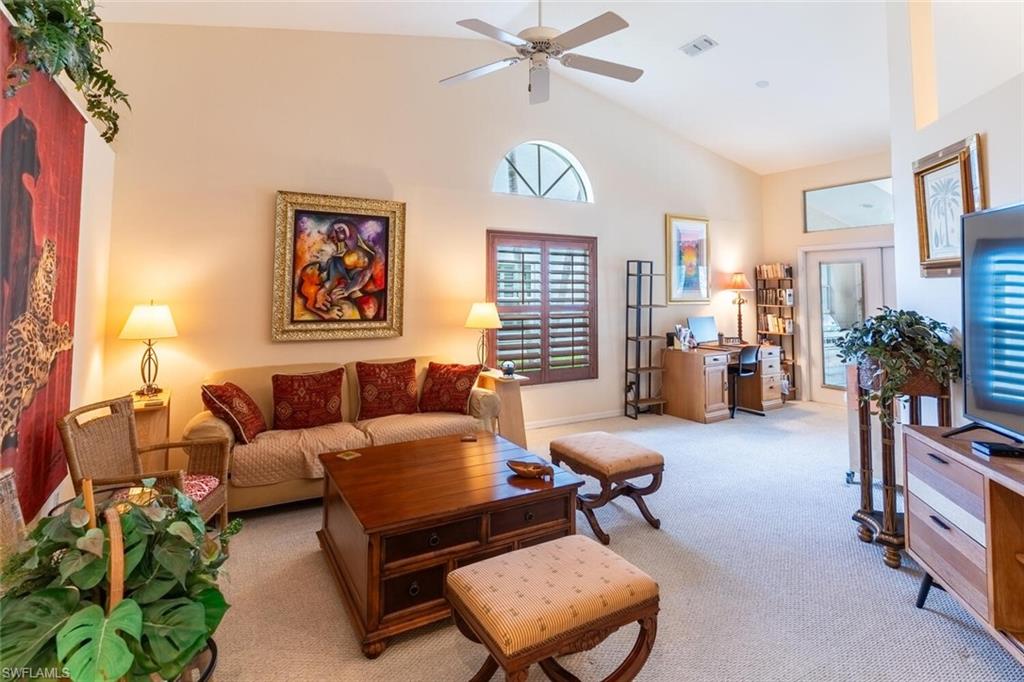 458 Countryside Drive Naples, FL 34104 - Photo 7 of 50 Living area featuring carpet floors, high vaulted ceiling, and a ceiling fan