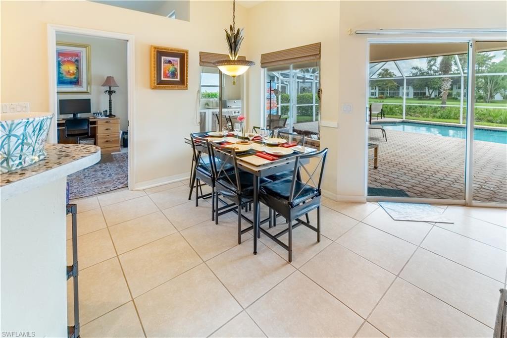 458 Countryside Drive Naples, FL 34104 - Photo 10 of 50 Dining space featuring light tile patterned floors, a sunroom, and an office area