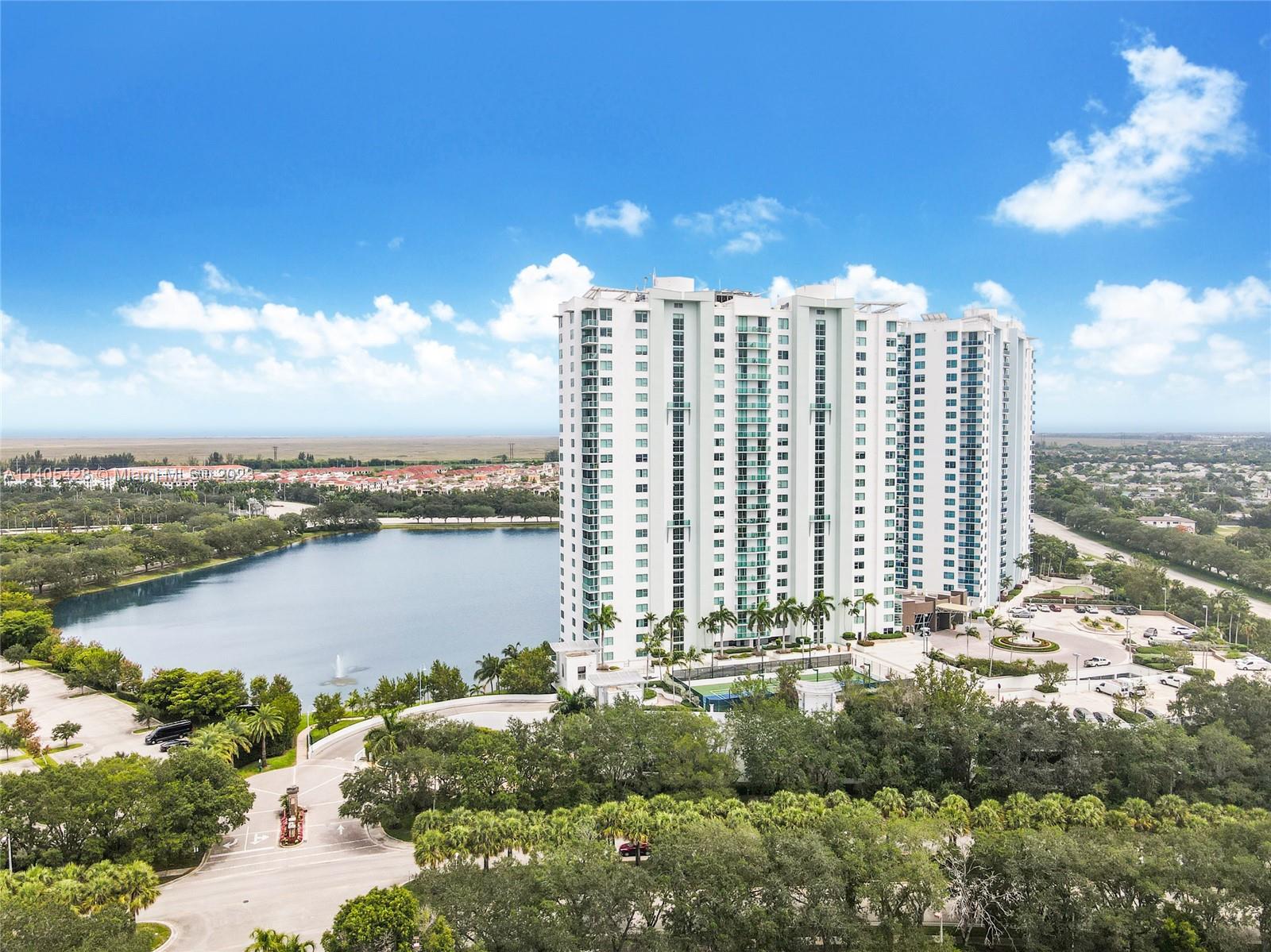 2681 North Flamingo Road, Unit 1906S Sunrise, FL 33323 - Photo 2 of 16 a view of a lake with tall building