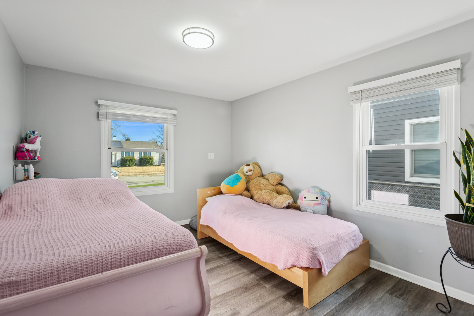 516 Dalhart Avenue Romeoville, IL 60446 - Photo 11 of 19 a bedroom with a bed and wooden floor