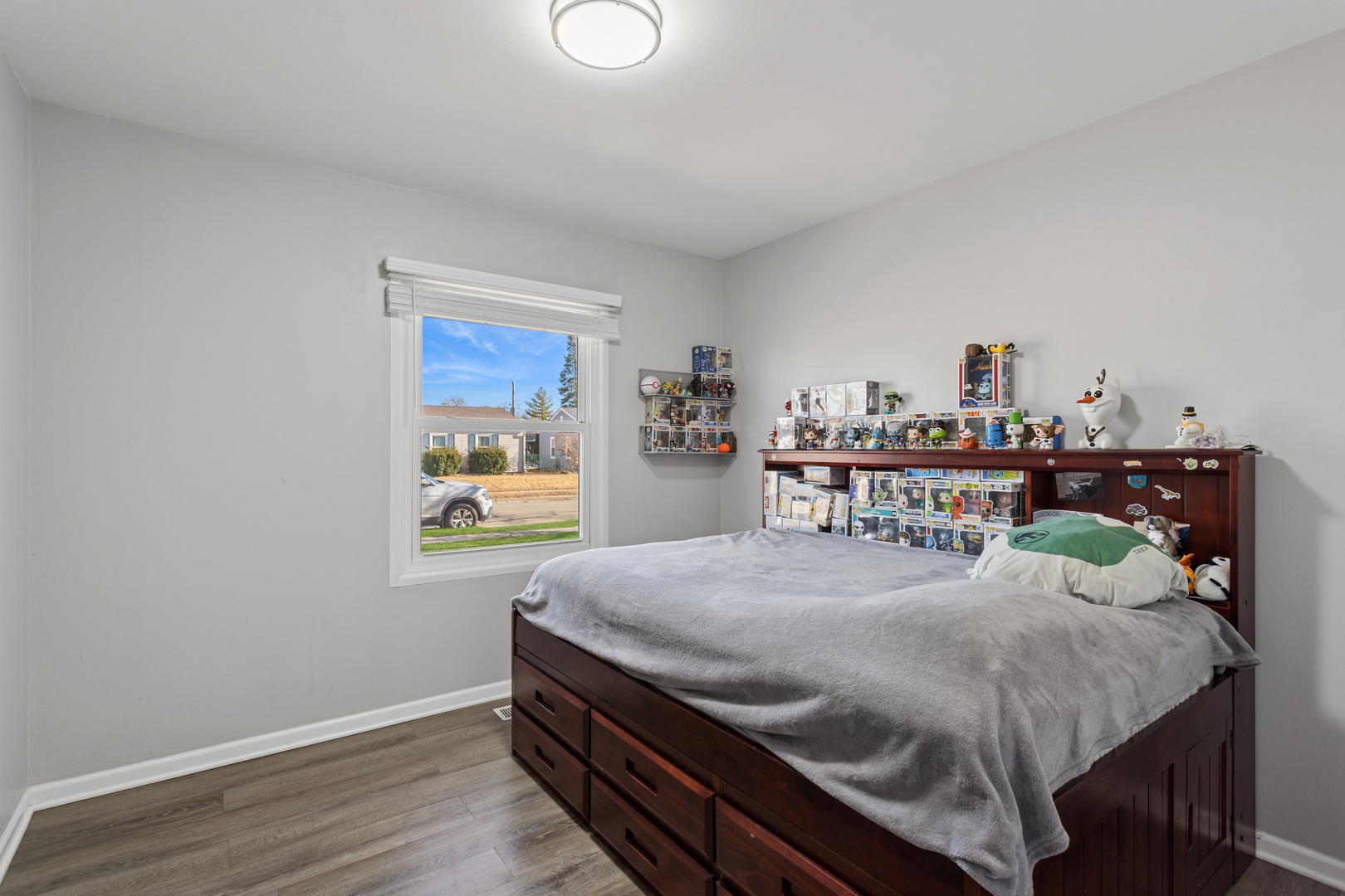 516 Dalhart Avenue Romeoville, IL 60446 - Photo 12 of 19 a bedroom with a bed and wooden floor