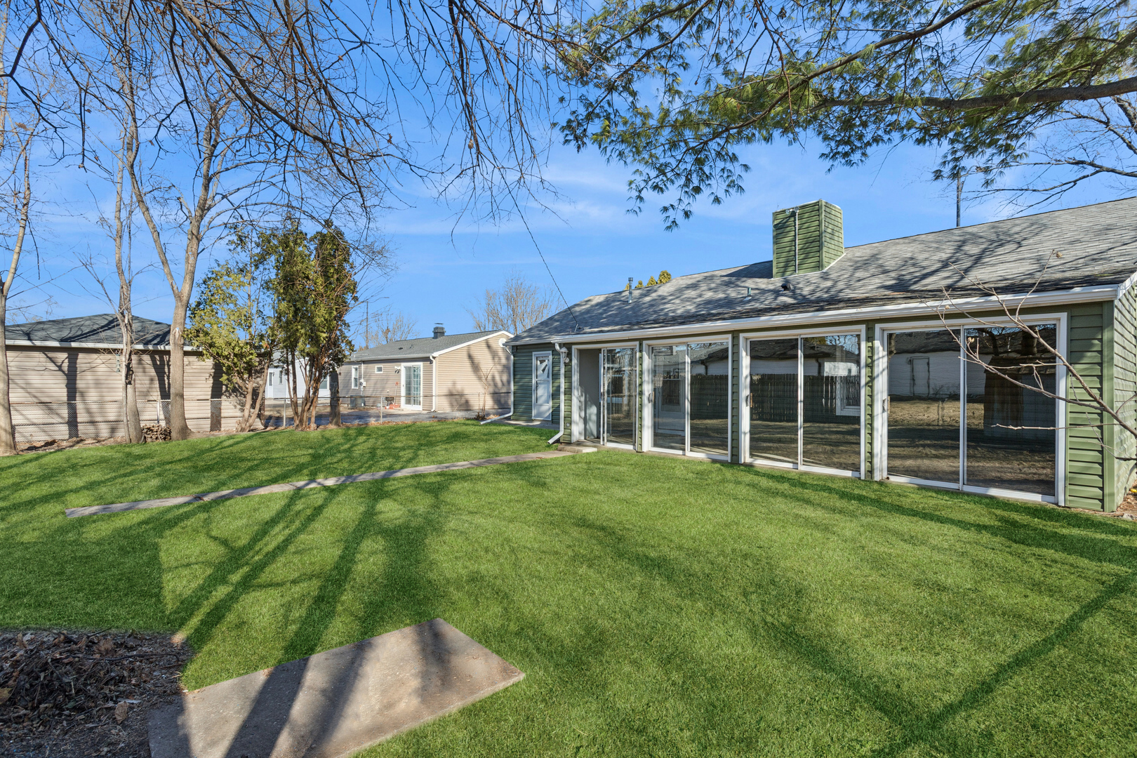 516 Dalhart Avenue Romeoville, IL 60446 - Photo 16 of 19 a view of a house with a backyard