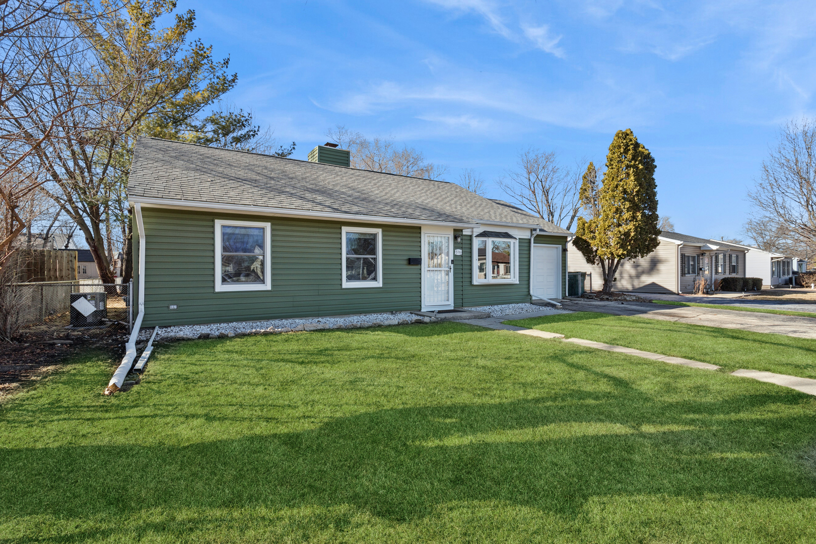 516 Dalhart Avenue Romeoville, IL 60446 - Photo 18 of 19 a backyard of a house with lots of green space
