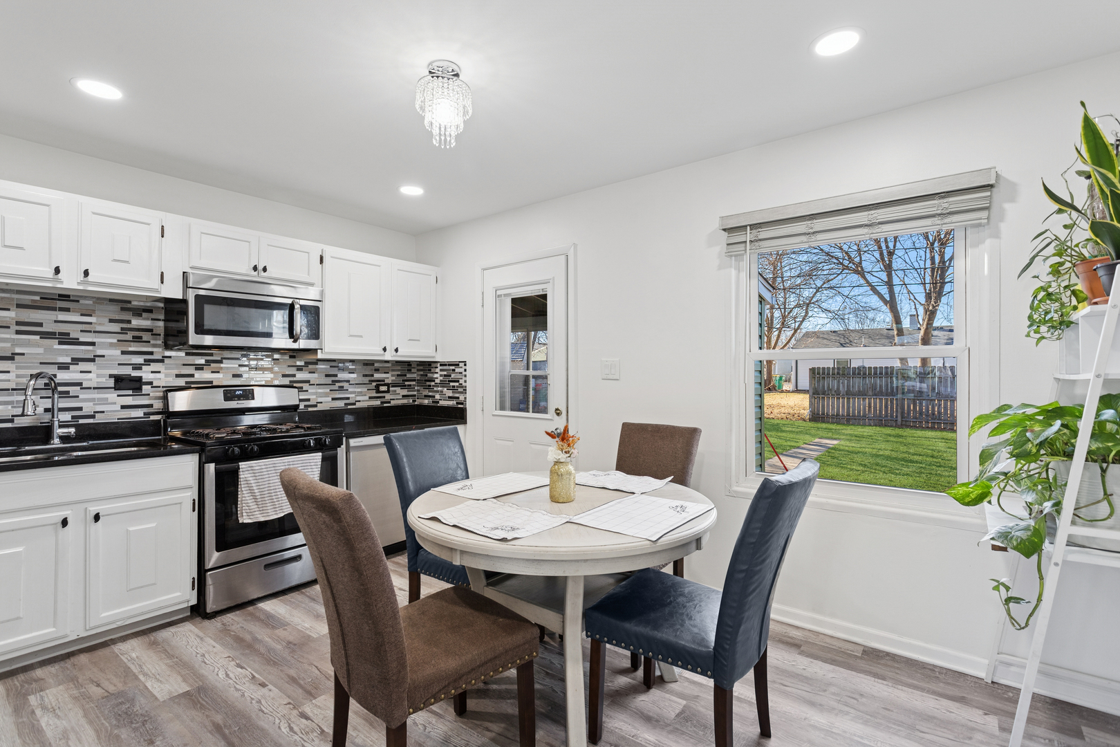 516 Dalhart Avenue Romeoville, IL 60446 - Photo 4 of 19 a view of a dining room with furniture window and wooden floor