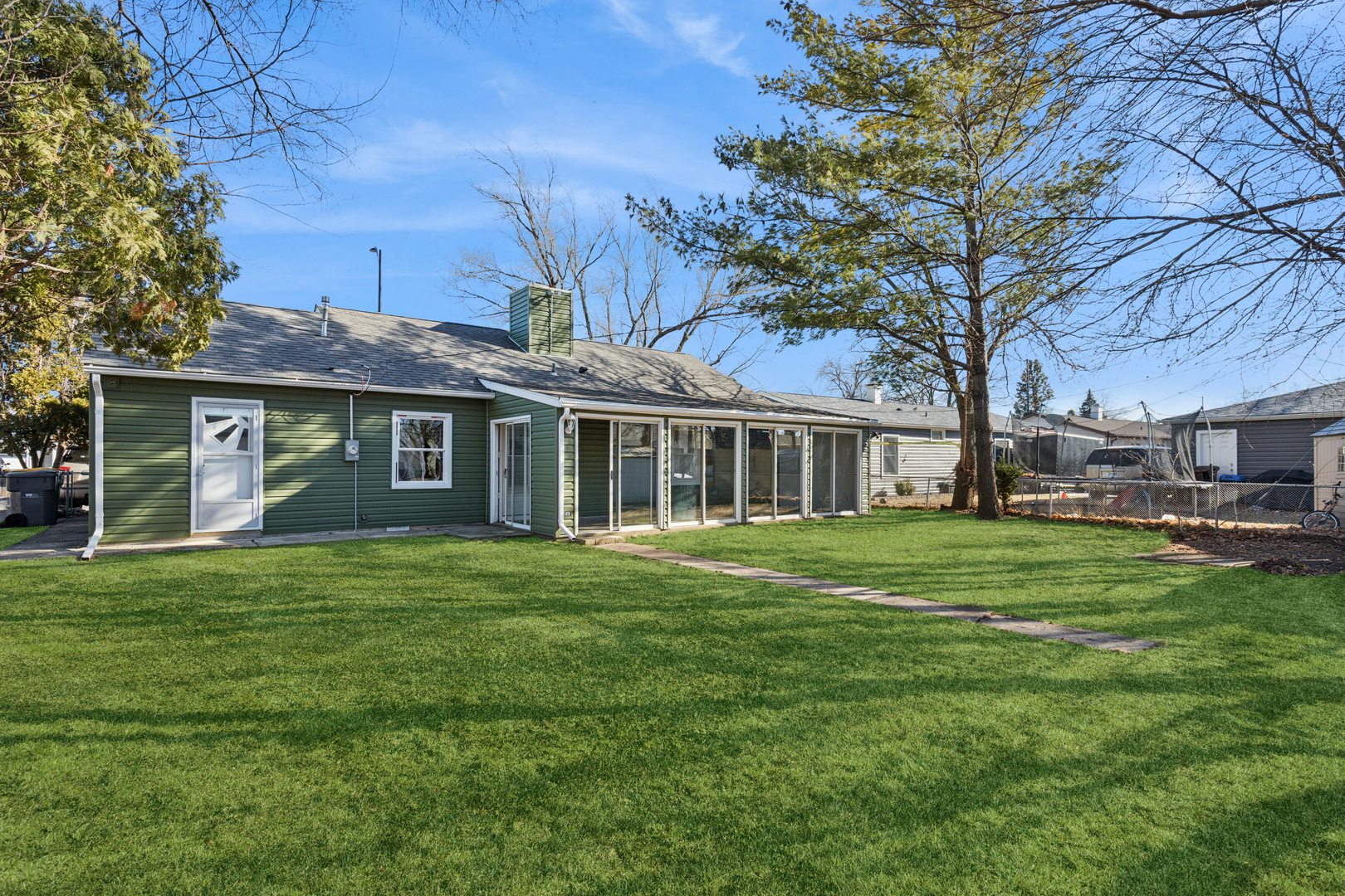 516 Dalhart Avenue Romeoville, IL 60446 - Photo 8 of 19 a front view of a house with a garden