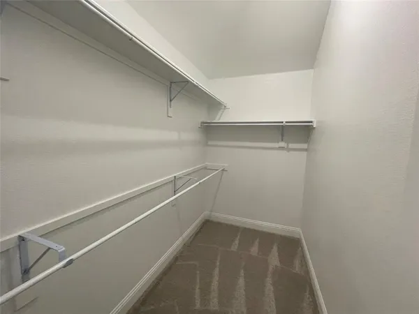 a view of an empty walk in closet