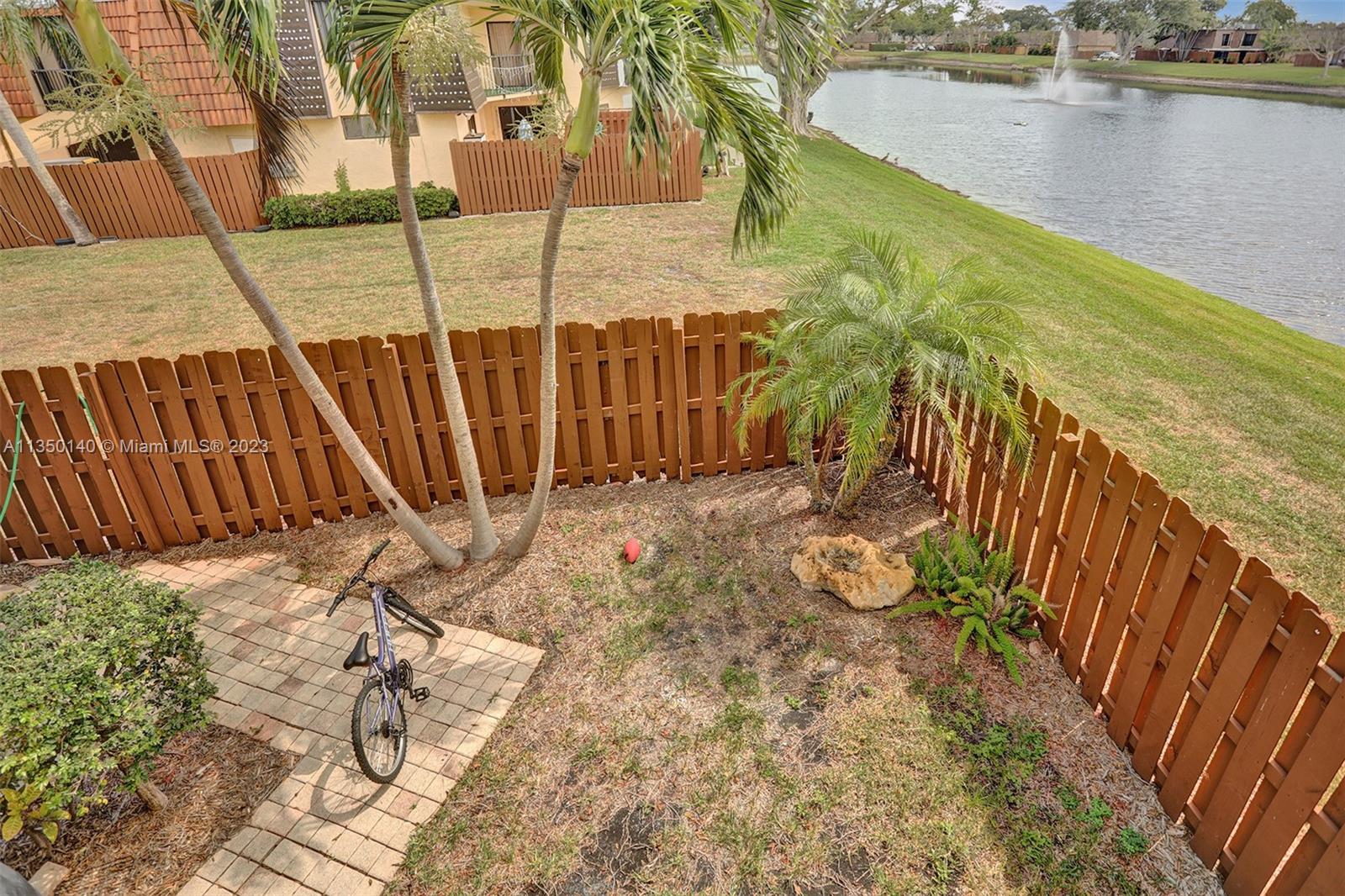 84 Springdale Circle Palm Springs, FL 33461 - Photo 17 of 32 a view of a balcony with floor to ceiling windows