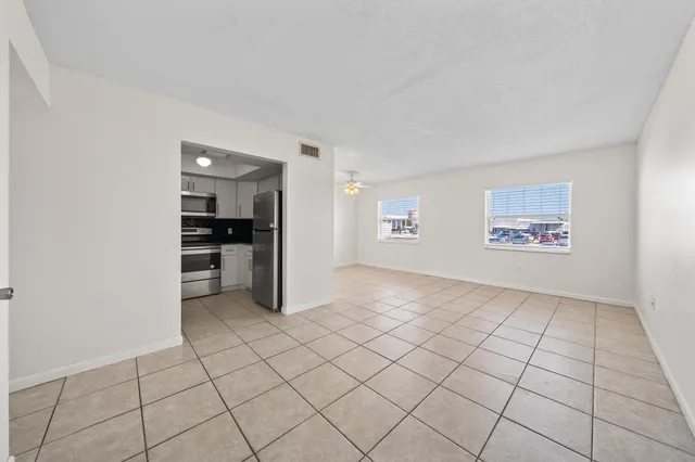 a view of an empty room and window