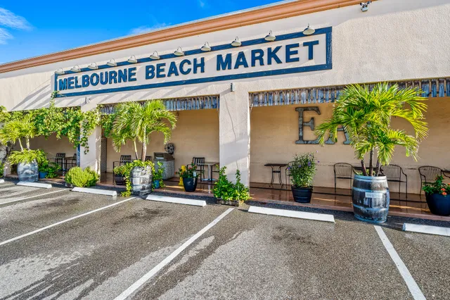 a view of a house with garden and plants