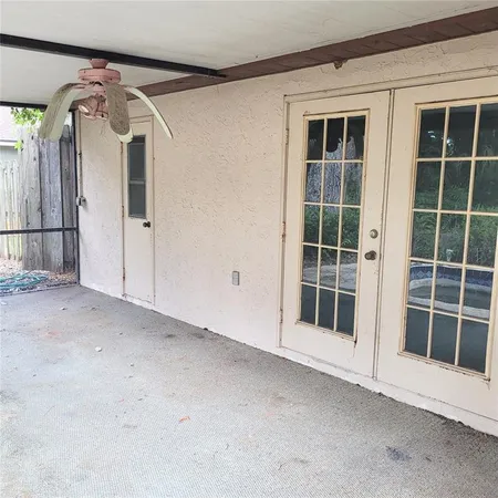 a view of empty room with windows