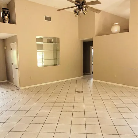 a view of an empty room and window