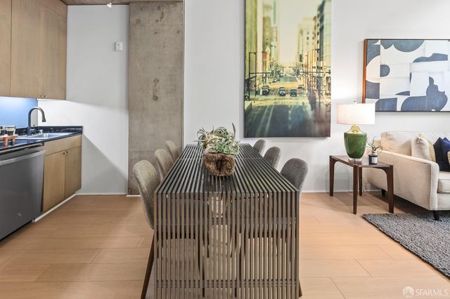 a balcony with furniture and wooden floor