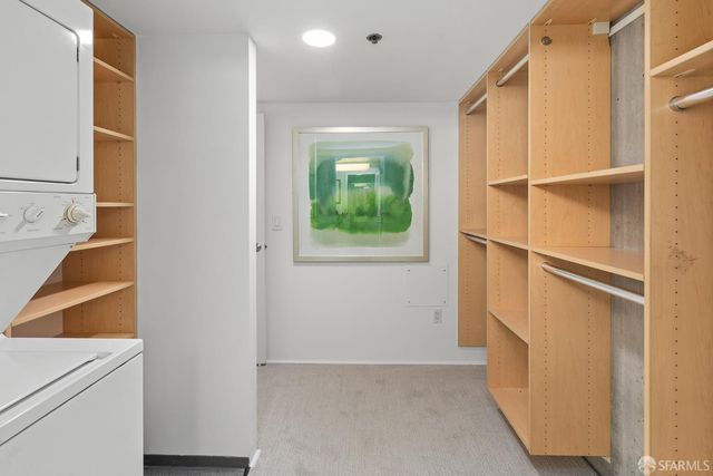 a view of hallway with washer and dryer