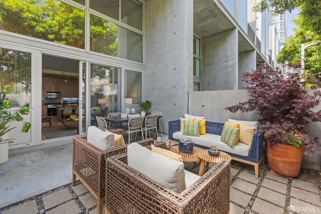 a outdoor space with patio furniture and potted plants