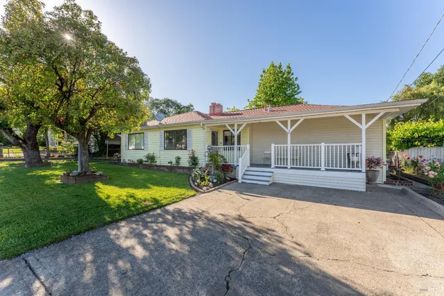 a front view of a house with garden