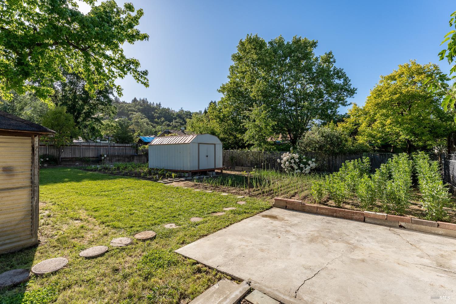 92 Oak Knoll Road Ukiah, CA 95482 - Photo 16 of 29 a backyard of a house with lots of green space