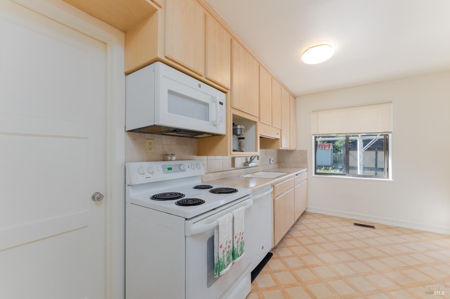 92 Oak Knoll Road Ukiah, CA 95482 - Photo 7 of 29 a kitchen with stainless steel appliances a cabinets and a counter top space