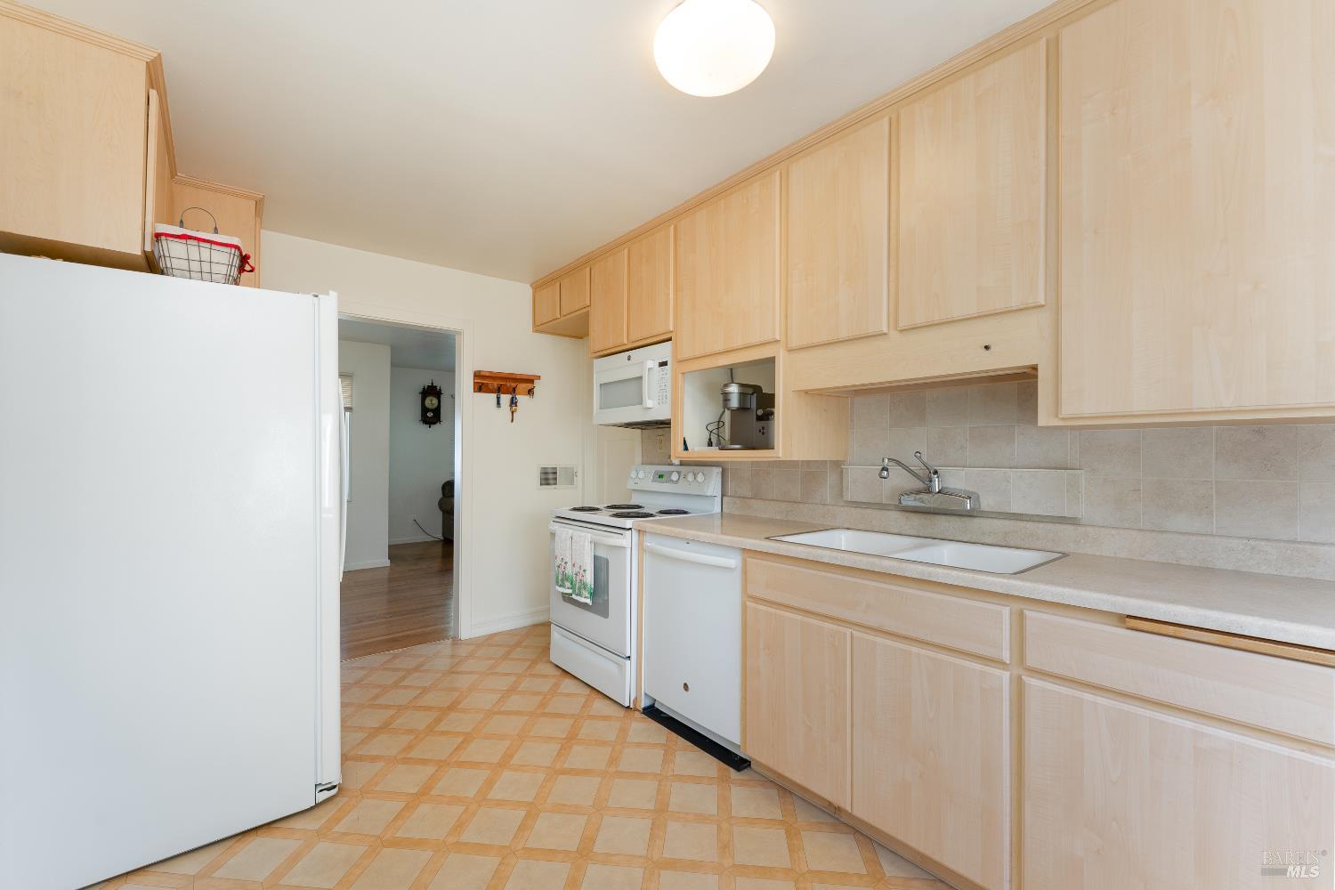 92 Oak Knoll Road Ukiah, CA 95482 - Photo 8 of 29 a kitchen with a sink cabinets and appliances