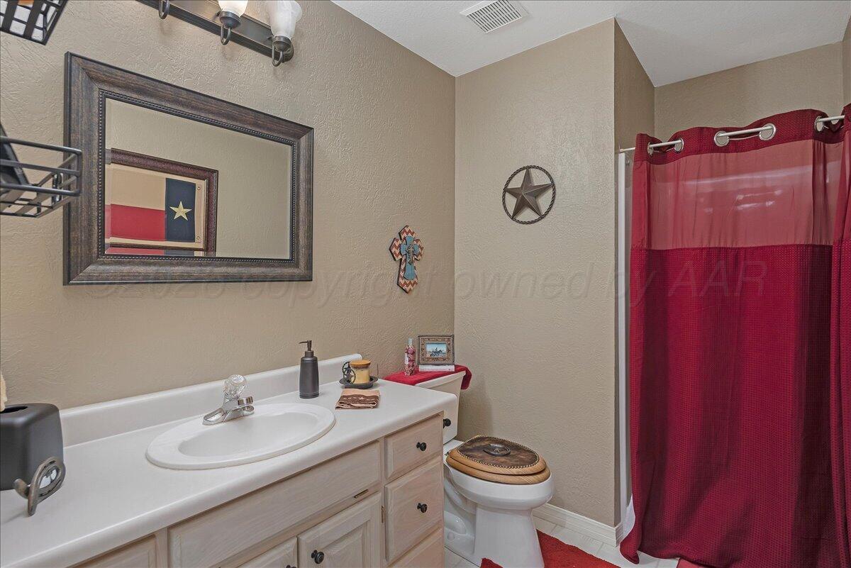 5 Locke Place Amarillo, TX 79124 - Photo 35 of 53 a bathroom with a sink vanity mirror and toilet