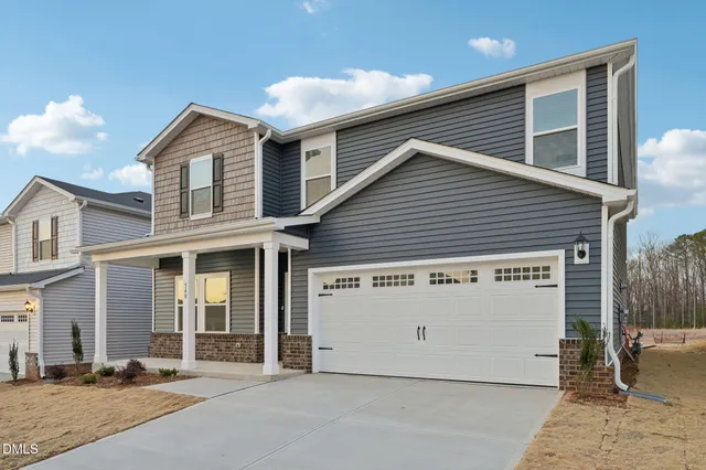 a view of a house with a garage