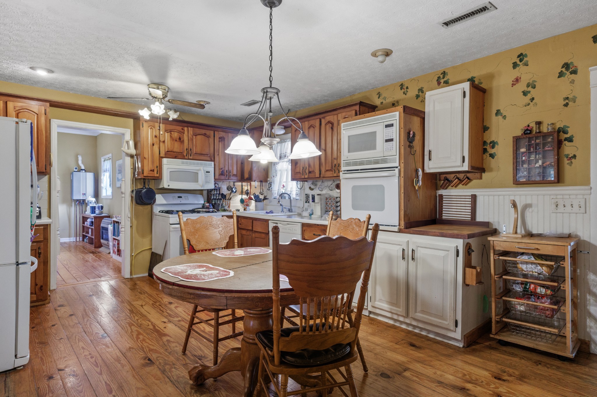 3371 Highway 76 Cottontown, TN 37048 - Photo 13 of 54 a view of a dining room with furniture window and wooden floor