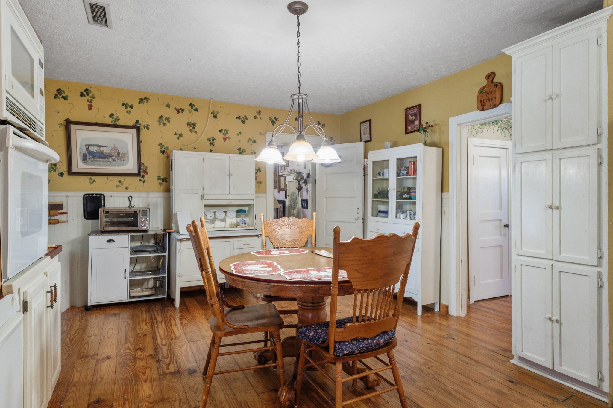3371 Highway 76 Cottontown, TN 37048 - Photo 14 of 54 a dining room with furniture a chandelier and wooden floor