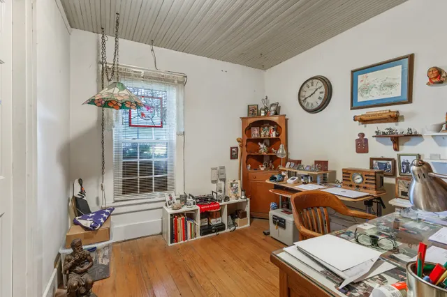 a bathroom with a sink vanity mirror and tub